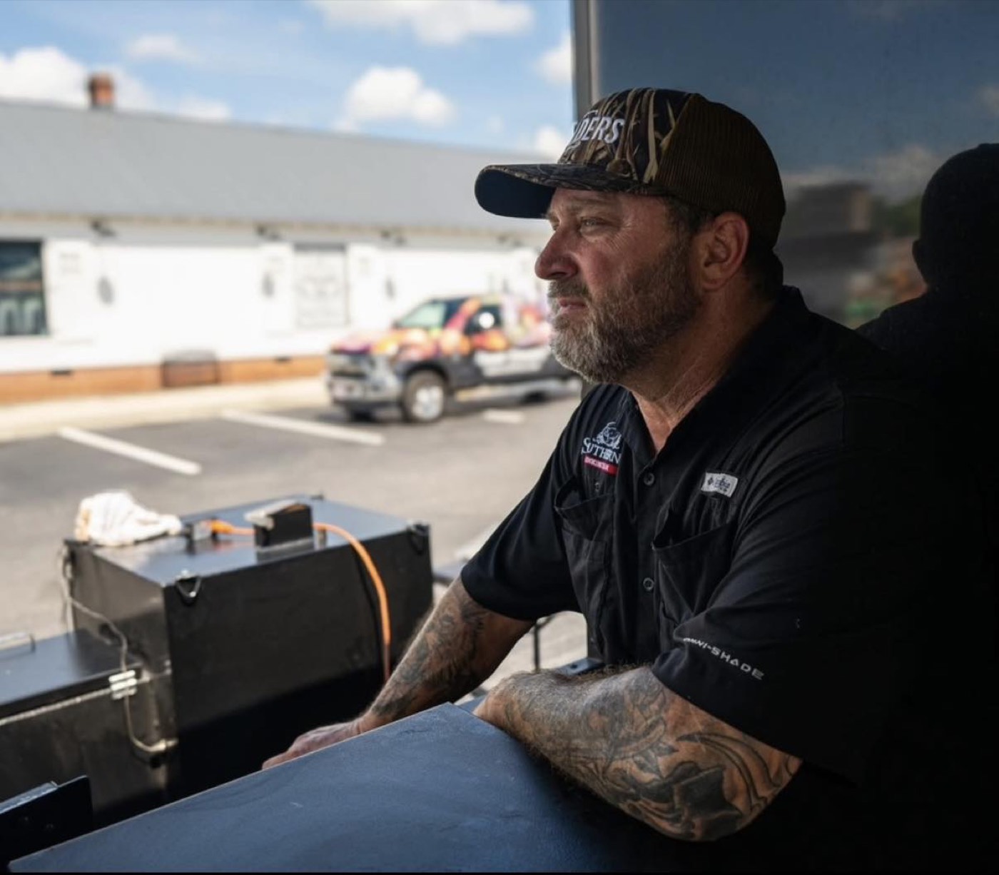 Southern Q pitmaster at the wood-fired pit, Louisburg NC